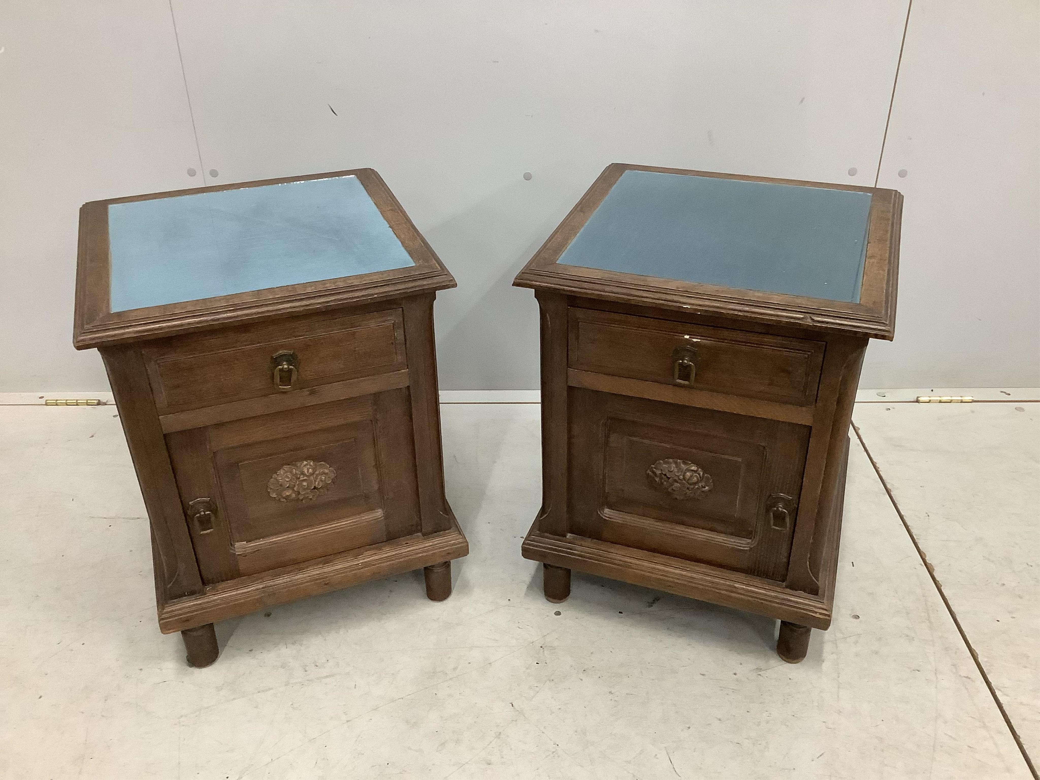 A pair of early 20th century French oak bedside cabinets, width 43cm, depth 42cm, height 55cm. Condition - fair